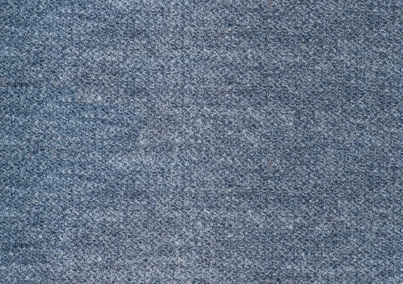 Detailní záběr modré textilní látky s texturou
